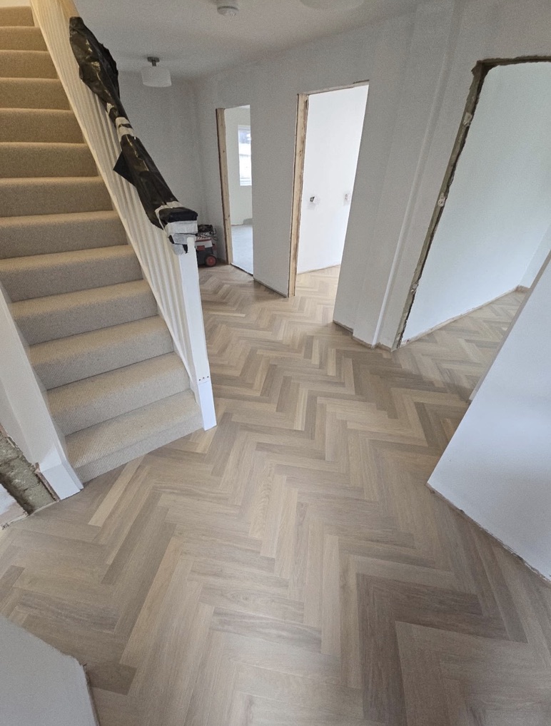 Pale herringbone by a staircase