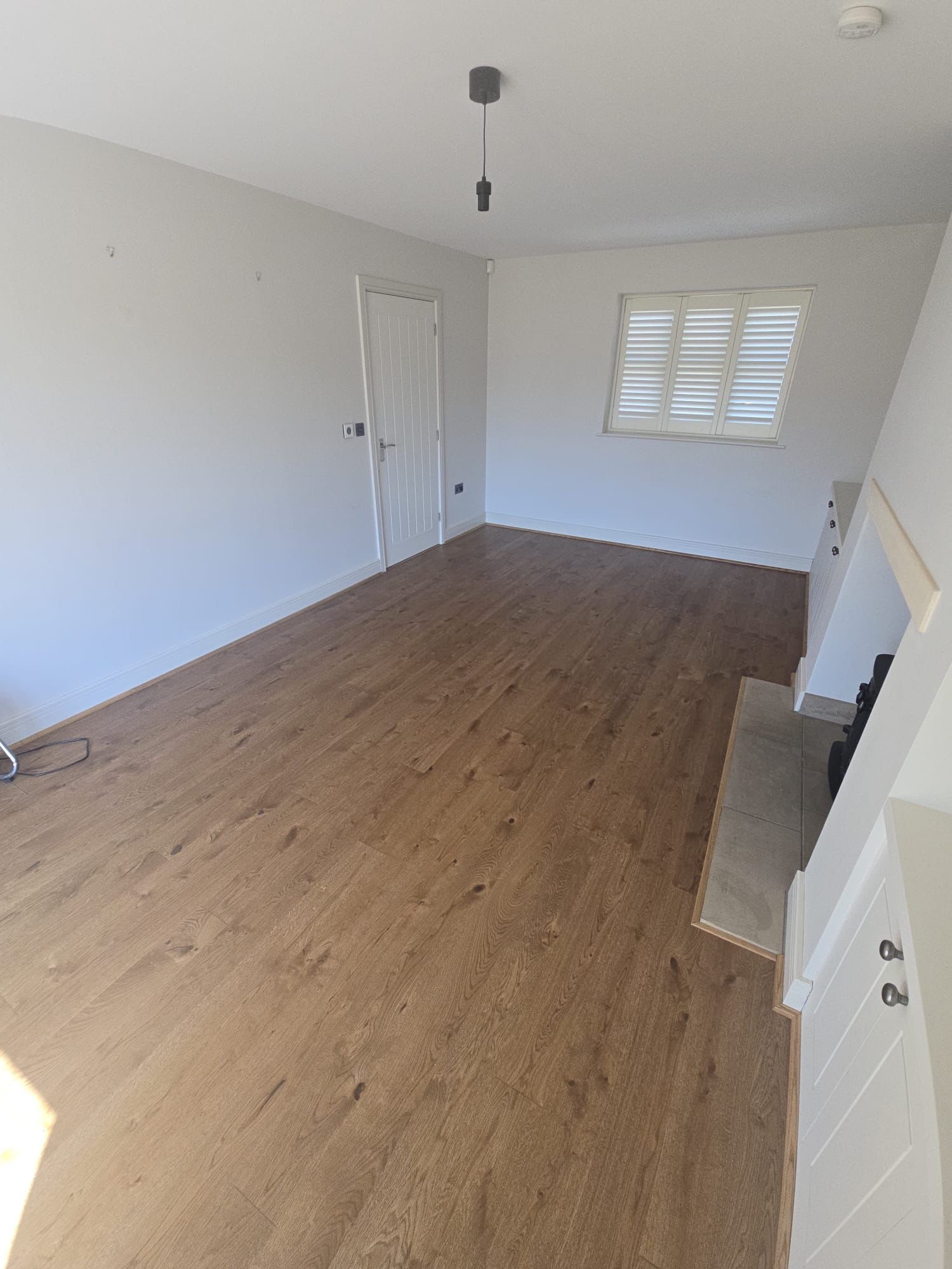 Warm oak planks with shuttered window