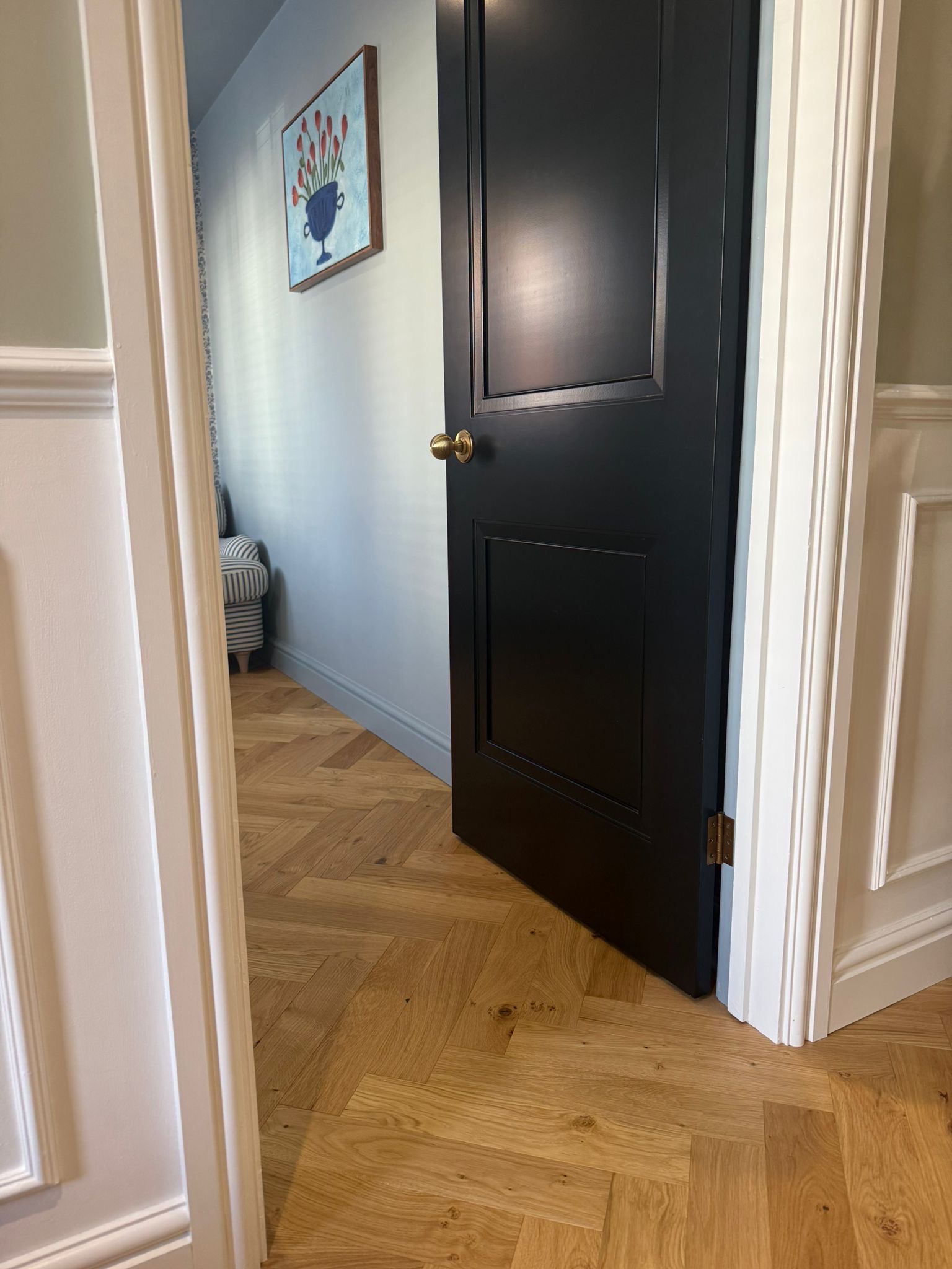 Herringbone meeting a black door frame
