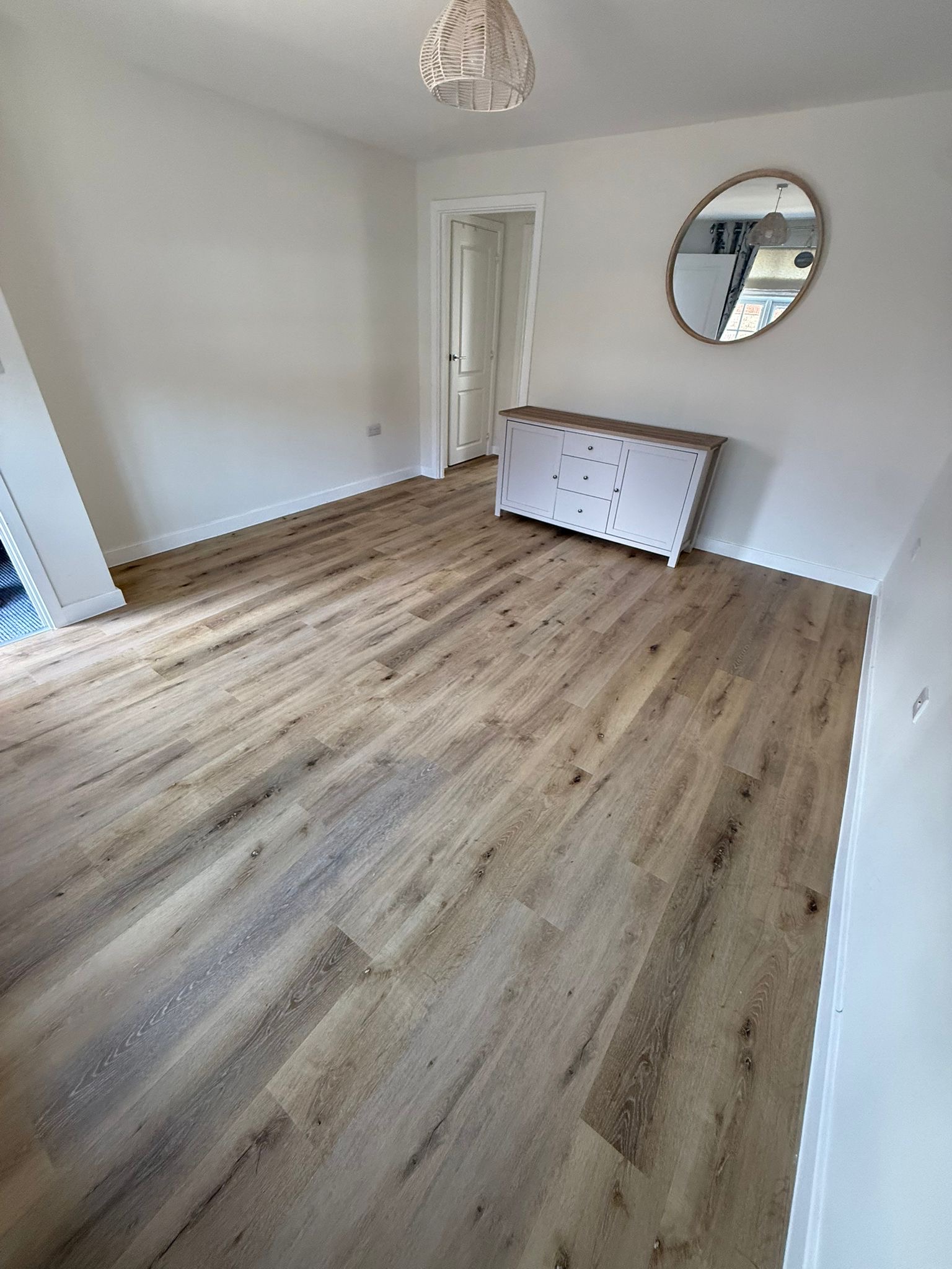 Pale planks in a bright new-build room