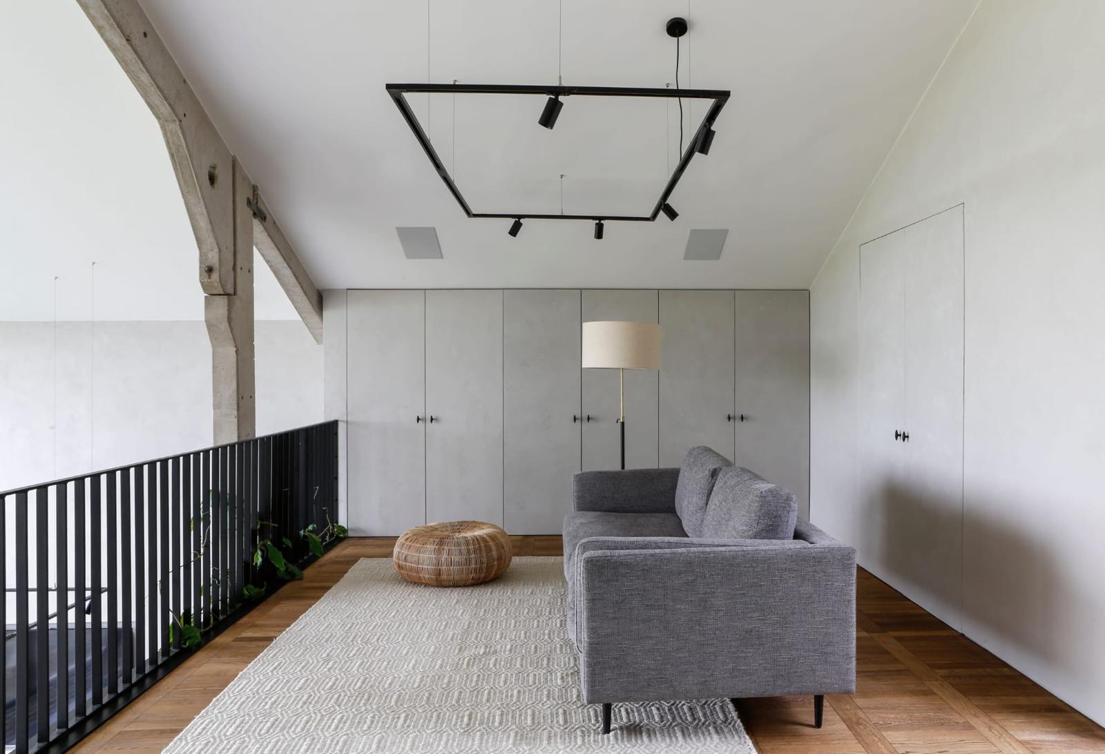 Warm patterned wood floor in a calm contemporary living room
